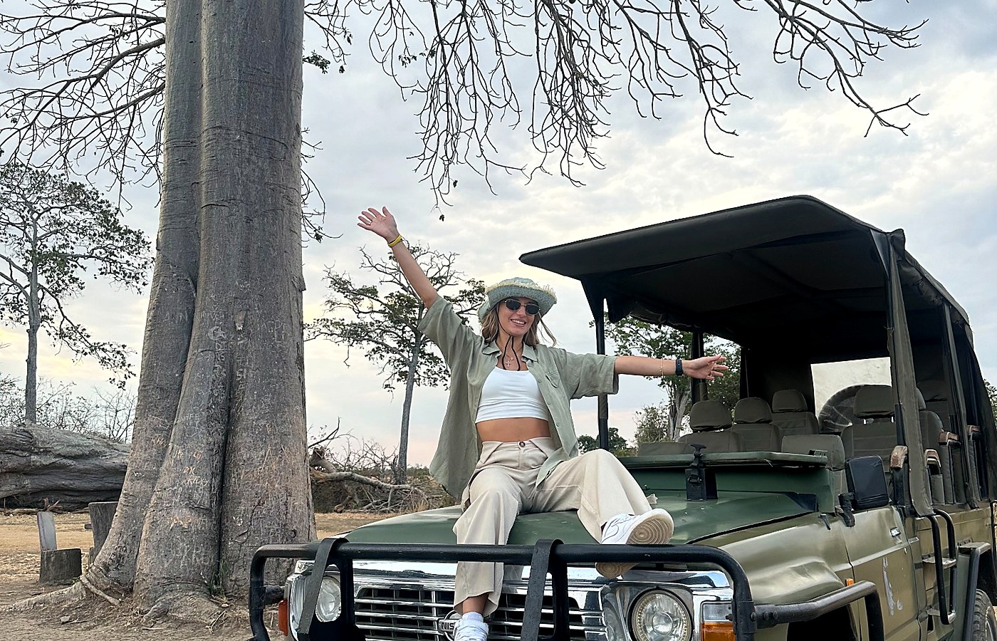 Safari guest seated on a private safari vehicle